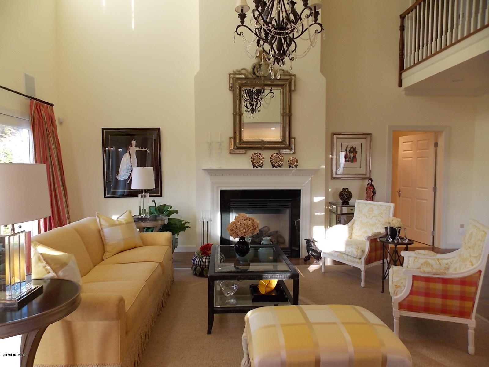 18 High Crest Road, Unit 18 Lenox, MA 01240 - Photo 11 of 34 a living room with furniture fireplace and a large mirror