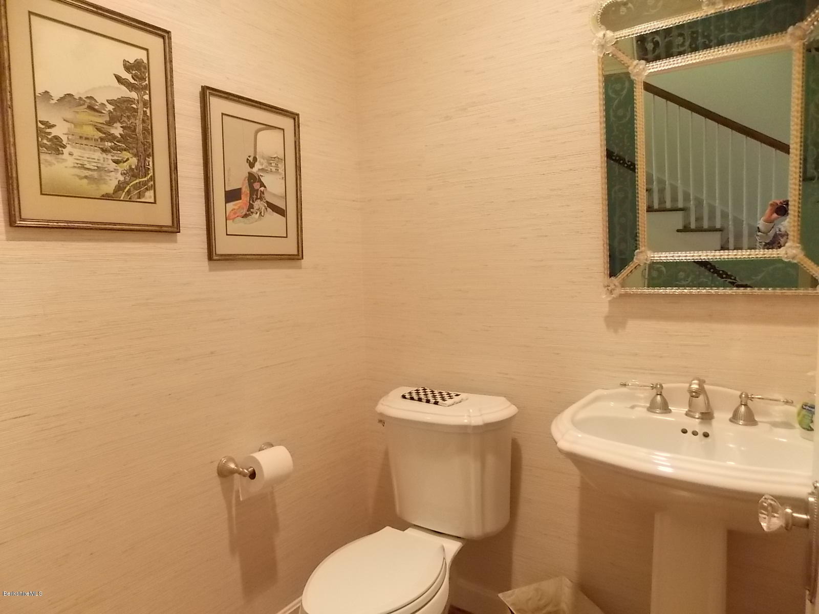 18 High Crest Road, Unit 18 Lenox, MA 01240 - Photo 13 of 34 a bathroom with a toilet sink and mirror