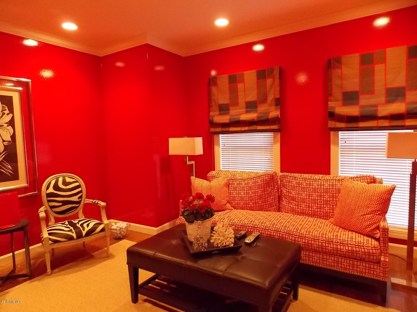 18 High Crest Road, Unit 18 Lenox, MA 01240 - Photo 14 of 34 a blue couch sitting in a room next to a building