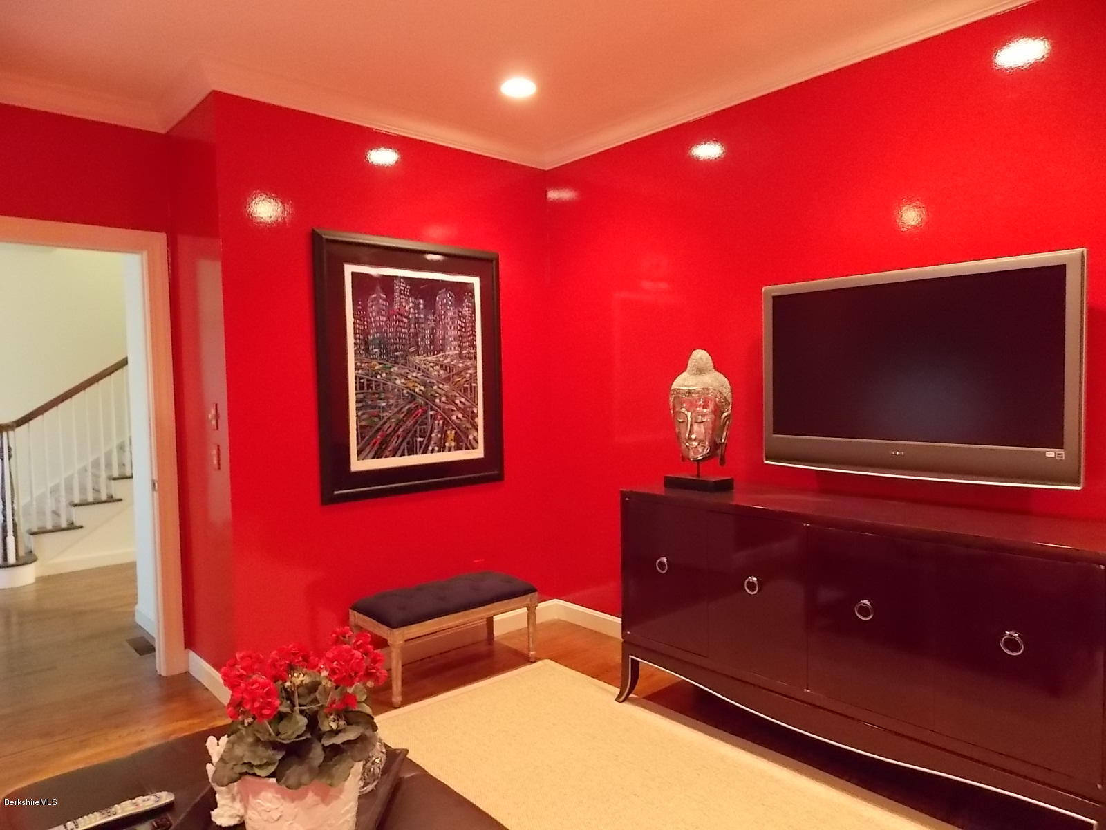 18 High Crest Road, Unit 18 Lenox, MA 01240 - Photo 15 of 34 a living room with furniture and a flat screen tv