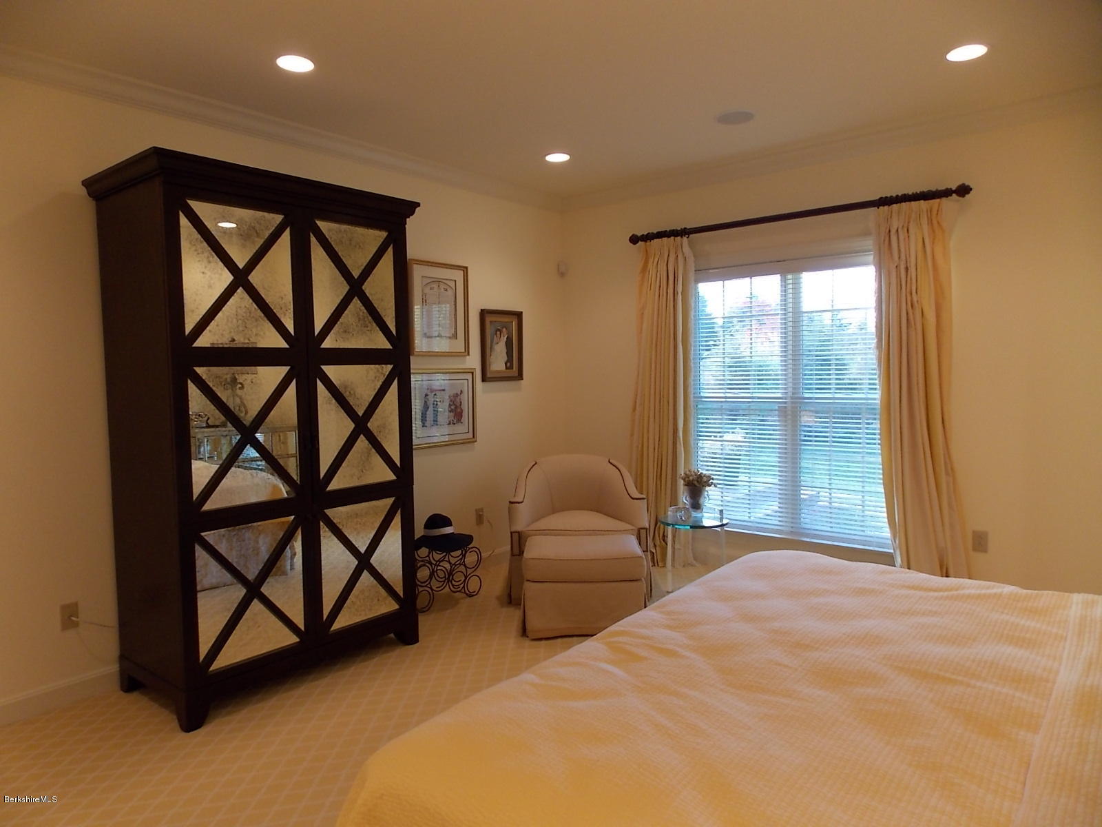 18 High Crest Road, Unit 18 Lenox, MA 01240 - Photo 18 of 34 a bedroom with a bed a couch and a window