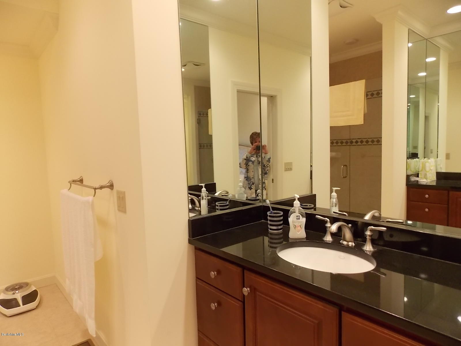 18 High Crest Road, Unit 18 Lenox, MA 01240 - Photo 19 of 34 a bathroom with a granite countertop sink and a mirror