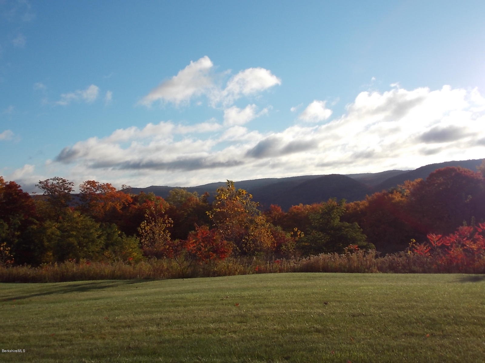 18 High Crest Road, Unit 18 Lenox, MA 01240 - Photo 3 of 34 a view of lake with mountain