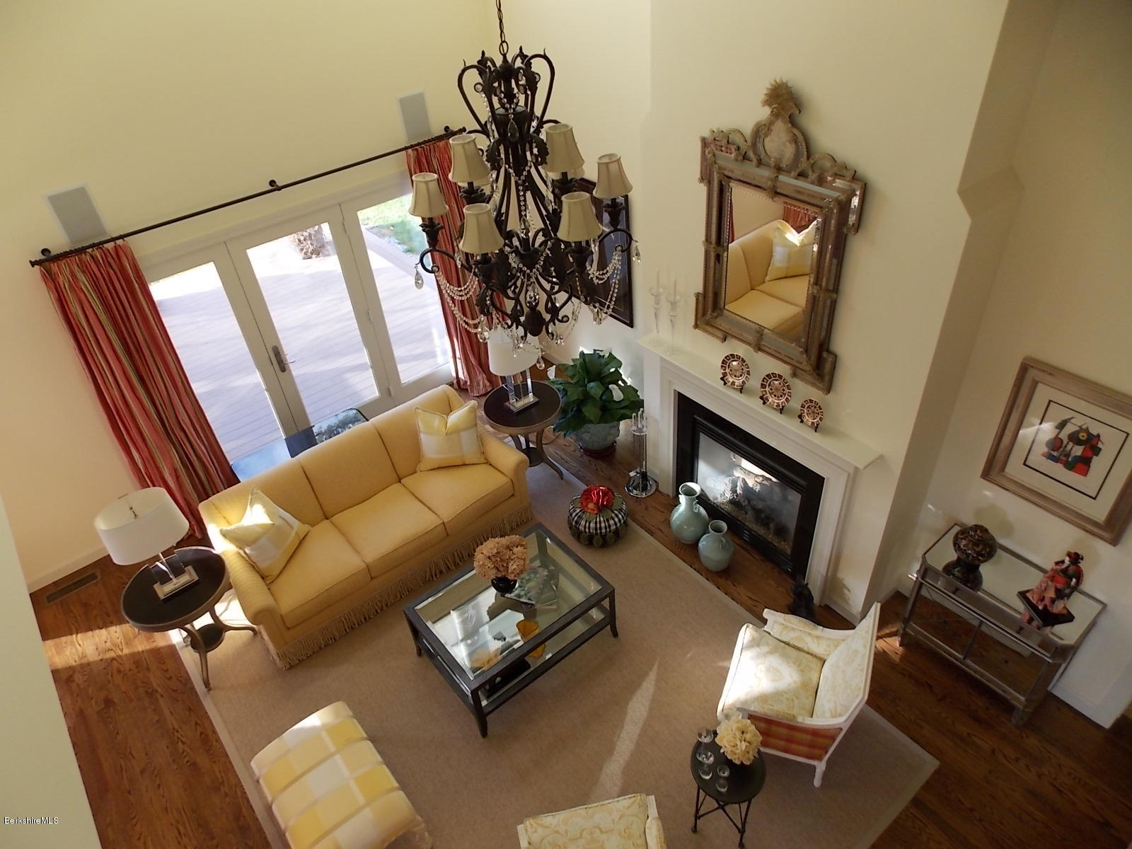 18 High Crest Road, Unit 18 Lenox, MA 01240 - Photo 30 of 34 a living room with furniture fireplace and flat screen tv