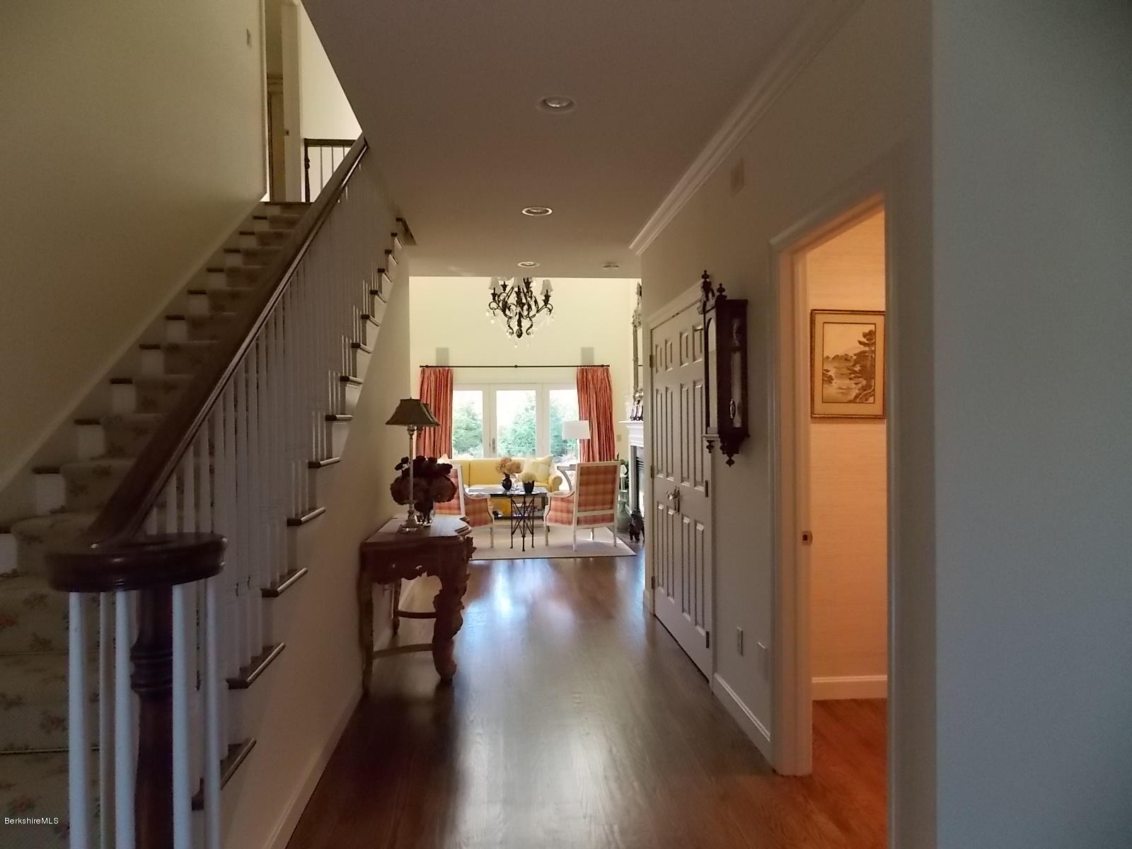 18 High Crest Road, Unit 18 Lenox, MA 01240 - Photo 31 of 34 a view of a hallway with couches and chandelier