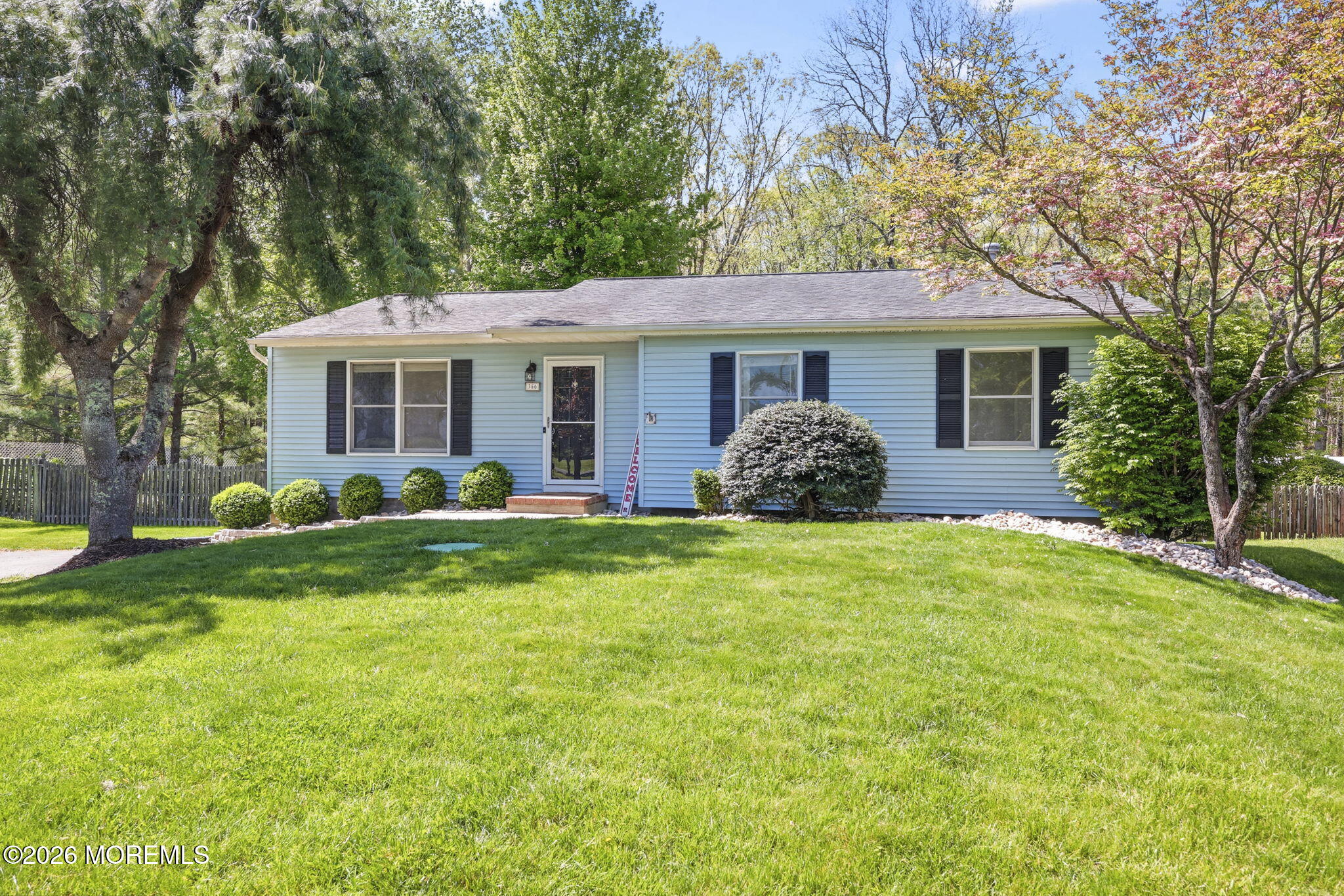 356 Leesville Road Jackson, NJ 08527 - Photo 4 of 46 a view of a house with a backyard and a large tree