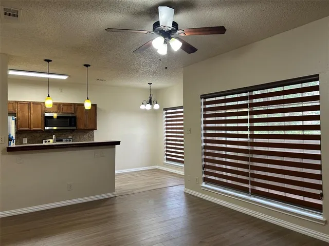 a kitchen with stainless steel appliances a sink and cabinets