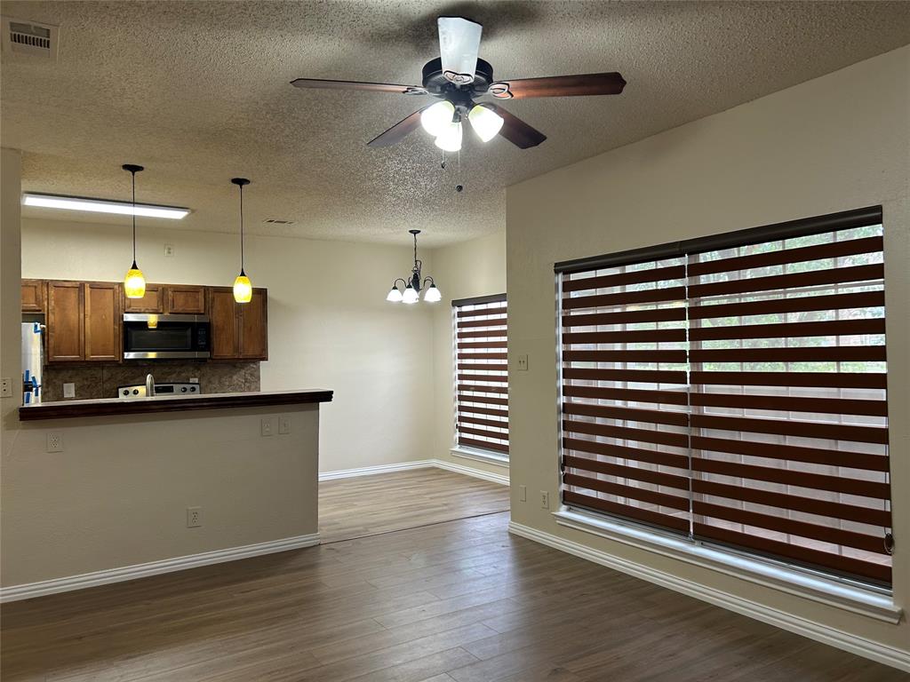 a kitchen with stainless steel appliances a sink and cabinets