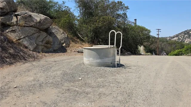 a view of a outdoor space with fountain and mountain view
