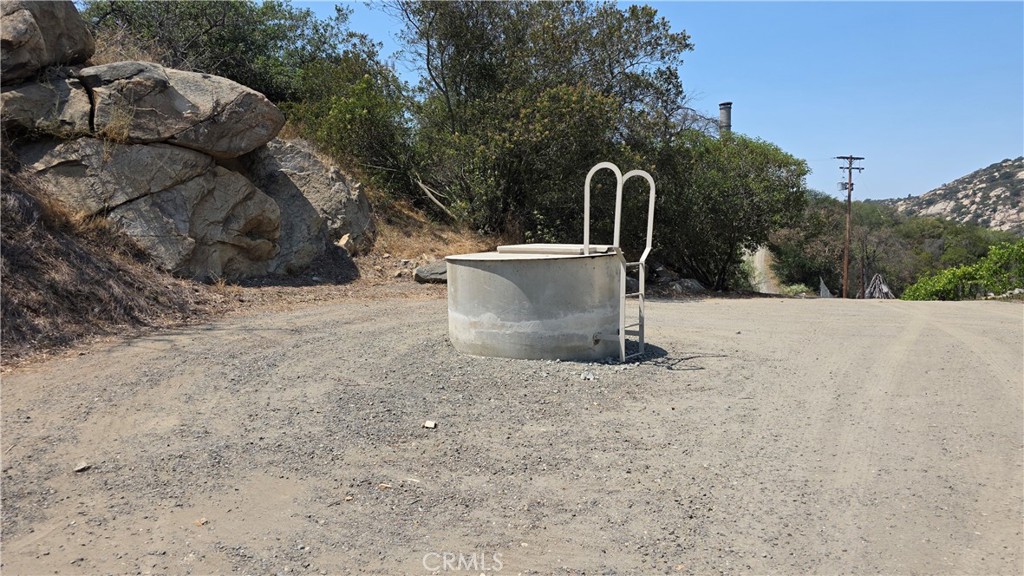 3027 Rainbow Valley Boulevard Fallbrook, CA 92028 - Photo 7 of 7 a view of a outdoor space with fountain and mountain view