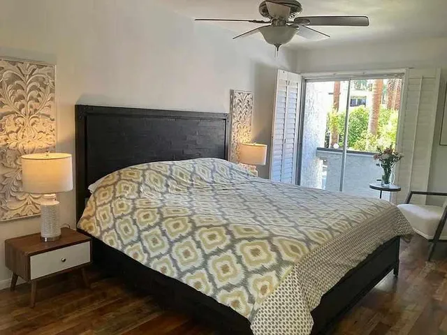 a bedroom with a bed and window