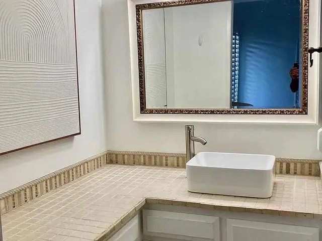 a bathroom with a sink and a mirror