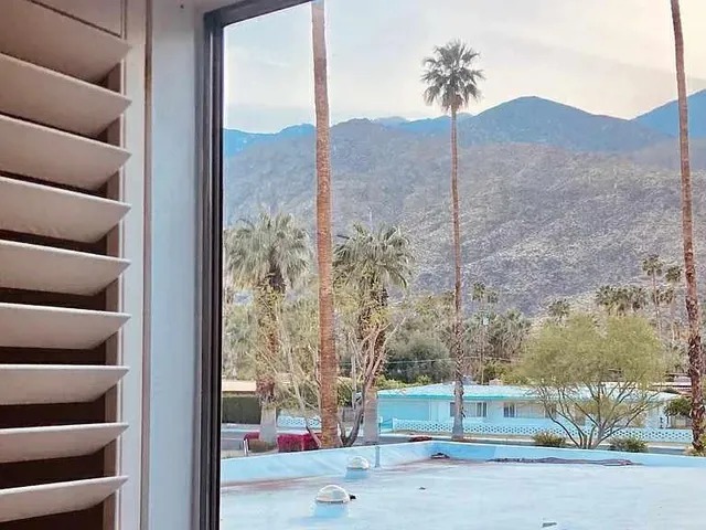 a view of a road from a corridor