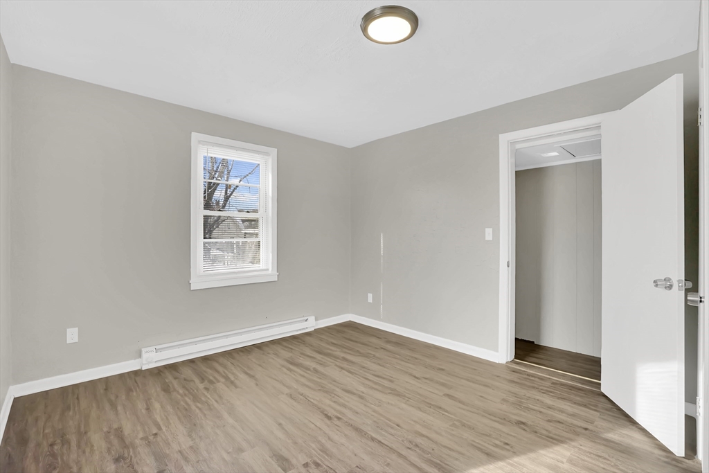 21 Depot Street Chicopee, MA 01013 - Photo 12 of 31 an empty room with wooden floor and windows