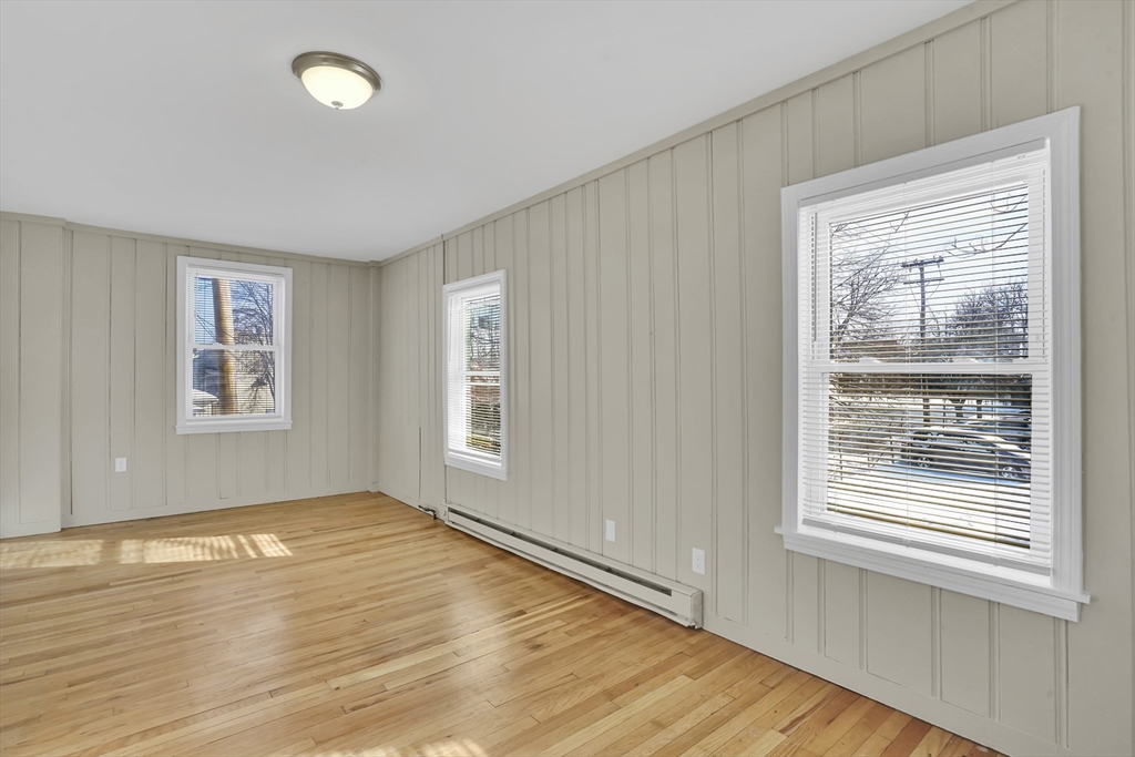 21 Depot Street Chicopee, MA 01013 - Photo 19 of 31 a view of an empty room with wooden floor and a window