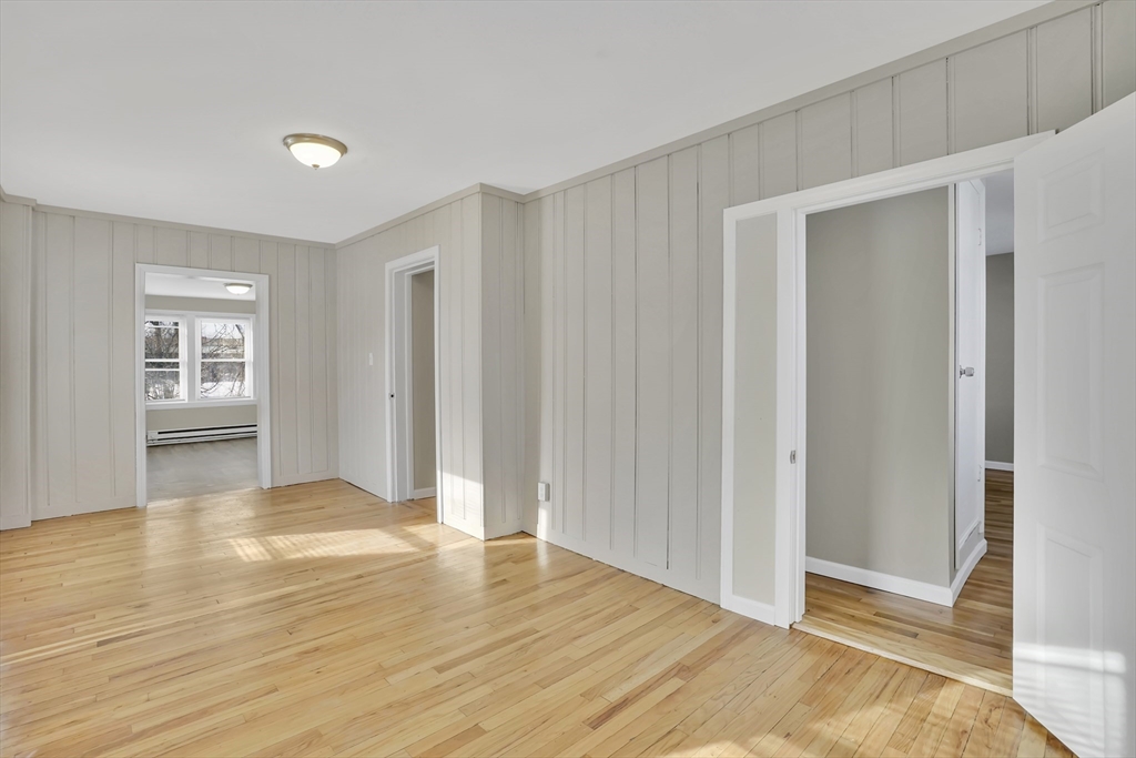 21 Depot Street Chicopee, MA 01013 - Photo 21 of 31 a view of an empty room with wooden floor and a window