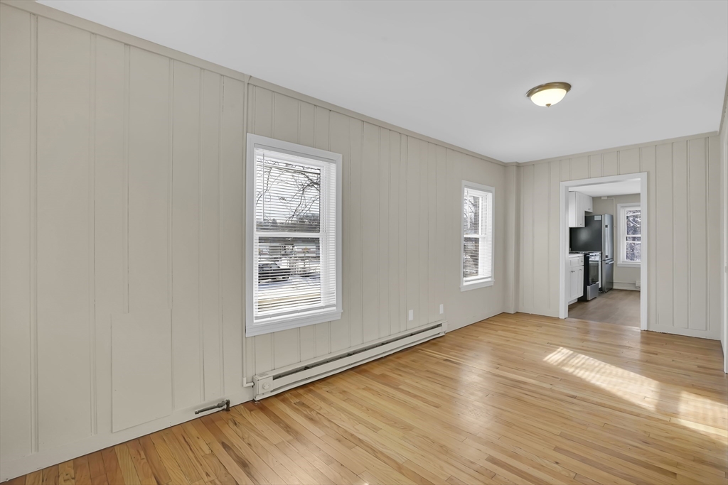21 Depot Street Chicopee, MA 01013 - Photo 22 of 31 a view of an empty room with wooden floor and a window