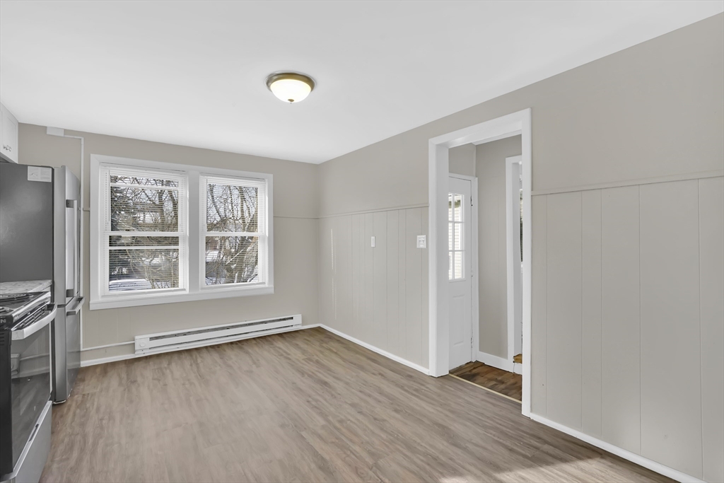 21 Depot Street Chicopee, MA 01013 - Photo 23 of 31 an empty room with wooden floor and windows