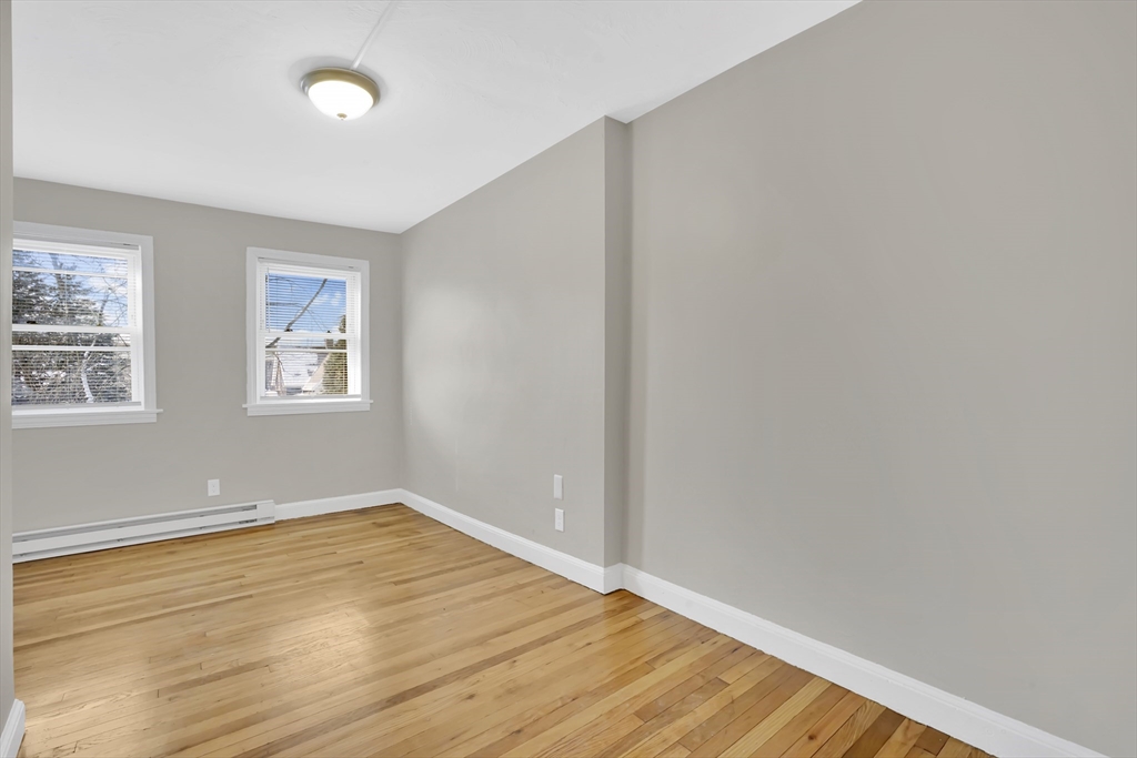 21 Depot Street Chicopee, MA 01013 - Photo 29 of 31 an empty room with wooden floor and windows
