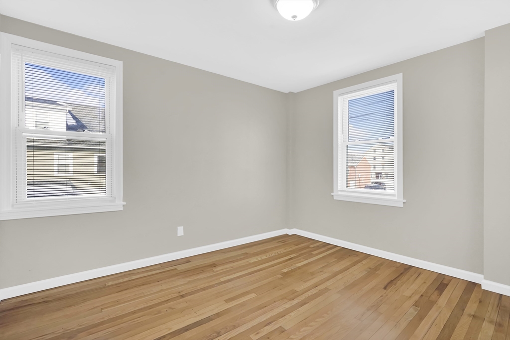 21 Depot Street Chicopee, MA 01013 - Photo 31 of 31 a view of empty room with wooden floor and fan