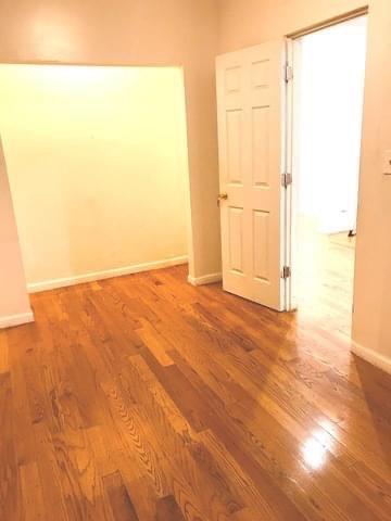 1828 North Pulaski Road, Unit 2 Chicago, IL 60639 - Photo 3 of 6 a view of empty room with wooden floor
