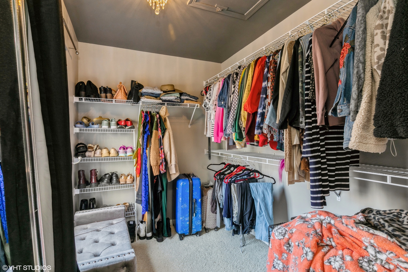 3340 Cameron Drive Elgin, IL 60124 - Photo 11 of 18 a view of walk in closet with clothes and shoes