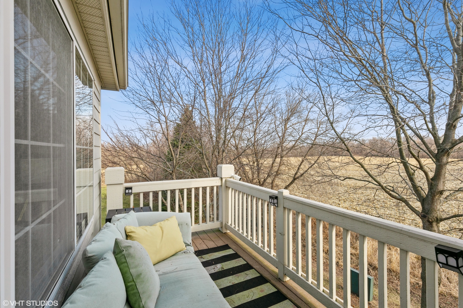 3340 Cameron Drive Elgin, IL 60124 - Photo 14 of 18 a view of balcony with wooden floor and fence
