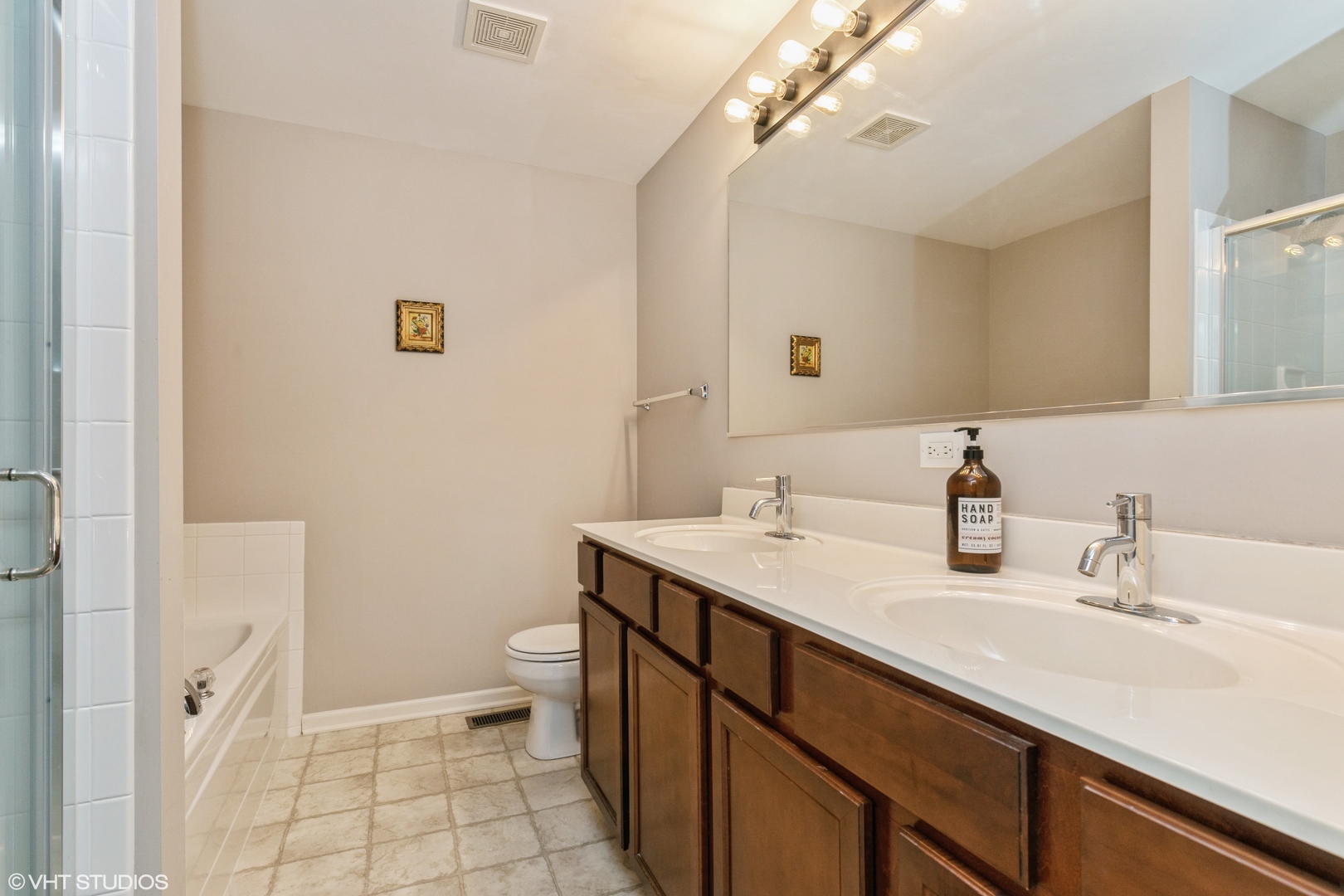 3340 Cameron Drive Elgin, IL 60124 - Photo 10 of 18 a bathroom with a sink a toilet a mirror and shower