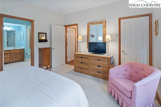 a bedroom with a bed and furniture