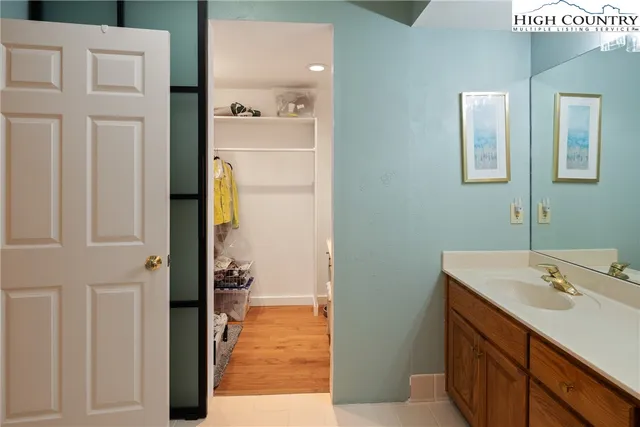 a bathroom with a sink and mirror