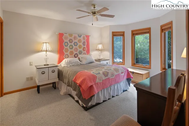 a bedroom with a bed and a couch