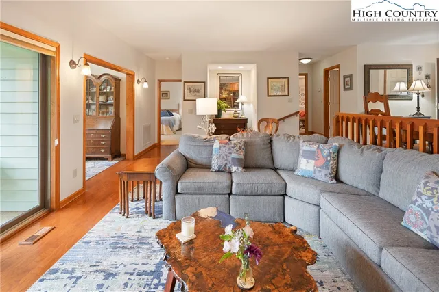 a living room with furniture and a rug