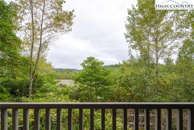 a view of backyard of house with green space