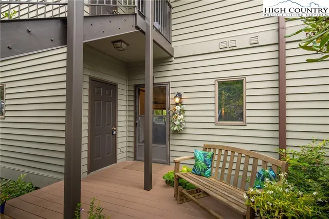 a view of a wooden bench in front of a house