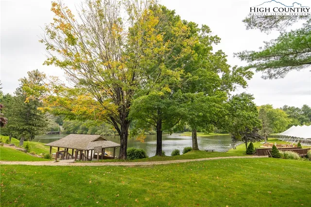 a view of a lake with tables and lake view