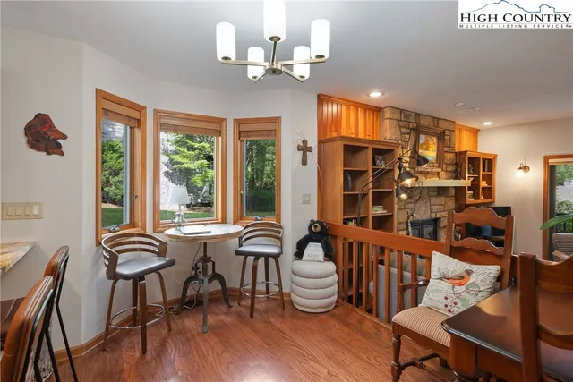 a view of a dining room with furniture window and wooden floor