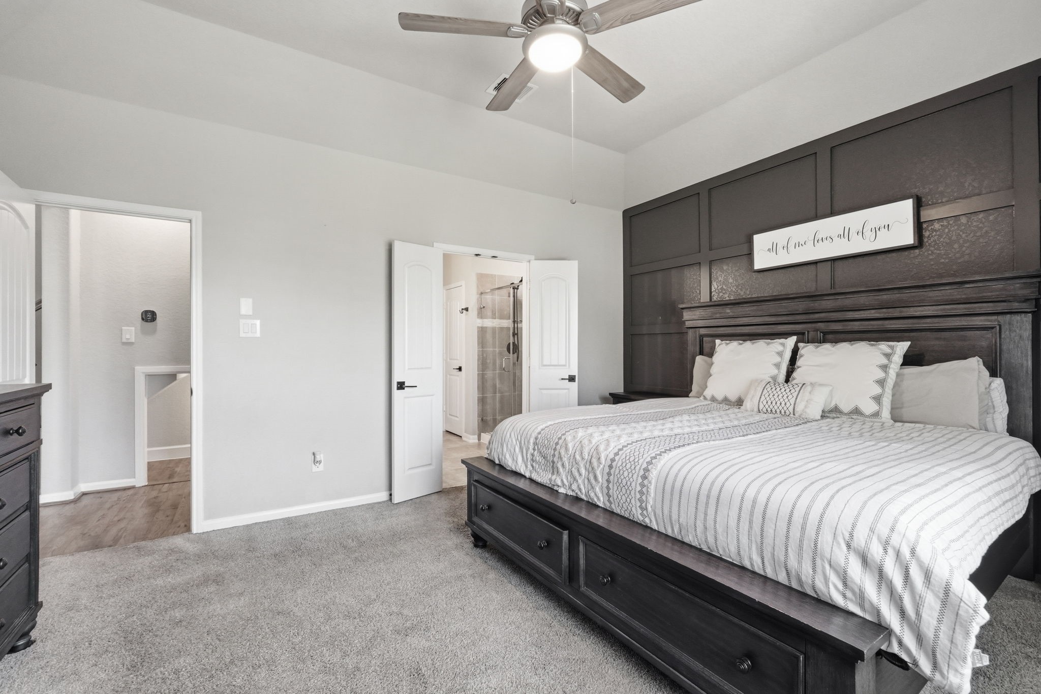 4334 Umber Shadow Drive Spring, TX 77386 - Photo 15 of 45 Primary bedroom offers generous dimensions, elevated ceilings, plush carpeting, and an ensuite bath with a spacious walk-in closet.