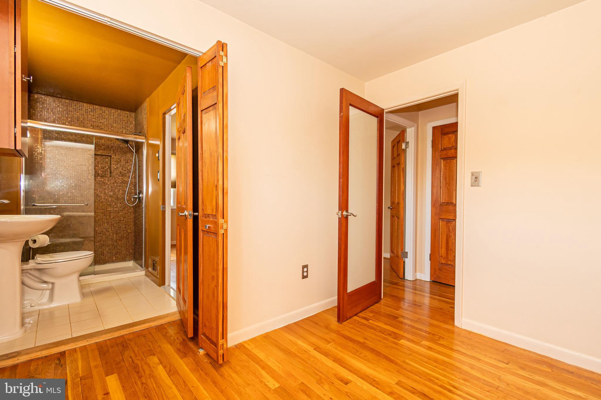 4523 Hawksbury Road Baltimore, MD 21208 - Photo 19 of 35 a view of a bathroom with a tub and shower