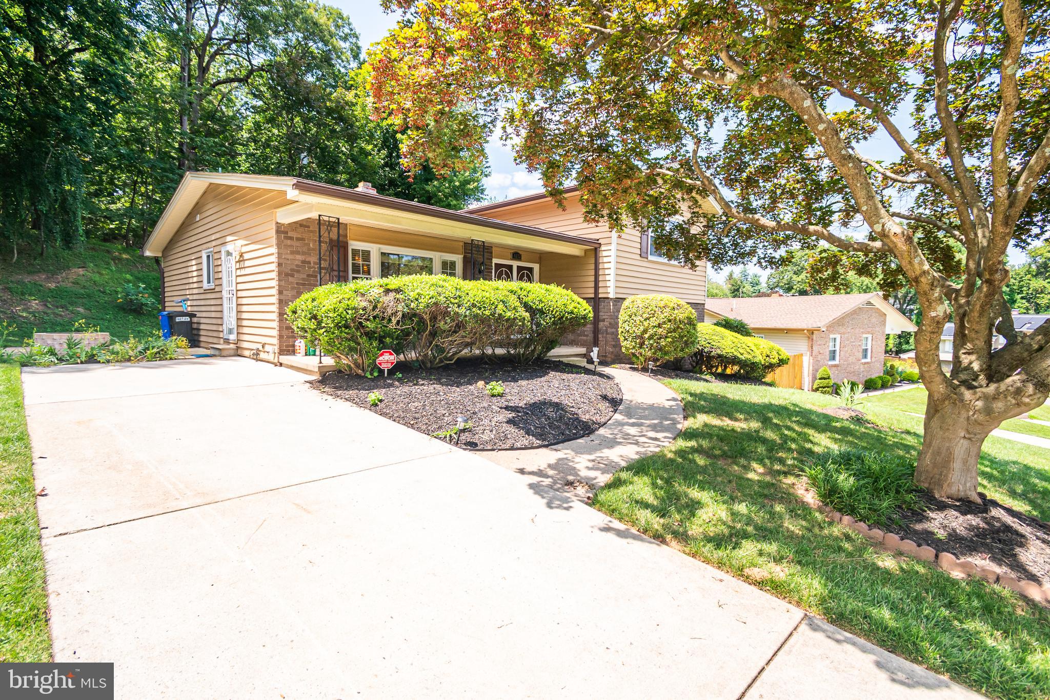 4523 Hawksbury Road Baltimore, MD 21208 - Photo 2 of 35 a front view of a house with a garden