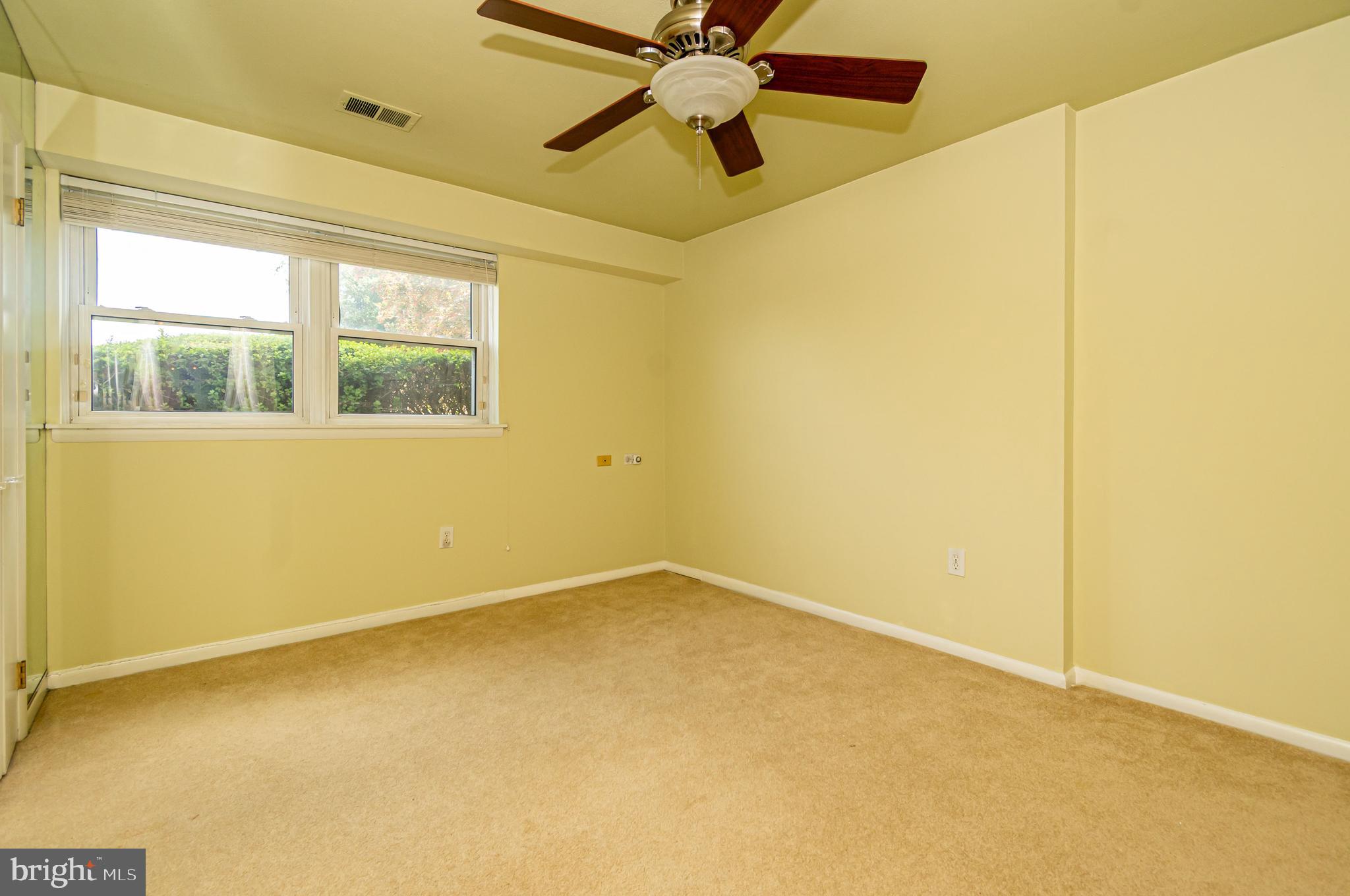 4523 Hawksbury Road Baltimore, MD 21208 - Photo 23 of 35 an empty room with a window