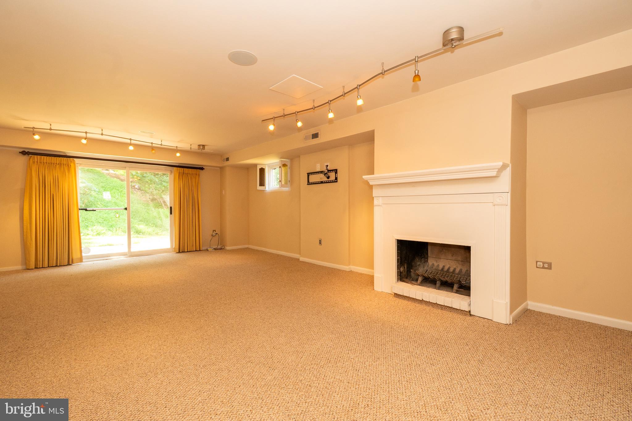 4523 Hawksbury Road Baltimore, MD 21208 - Photo 25 of 35 a view of empty room with a fireplace