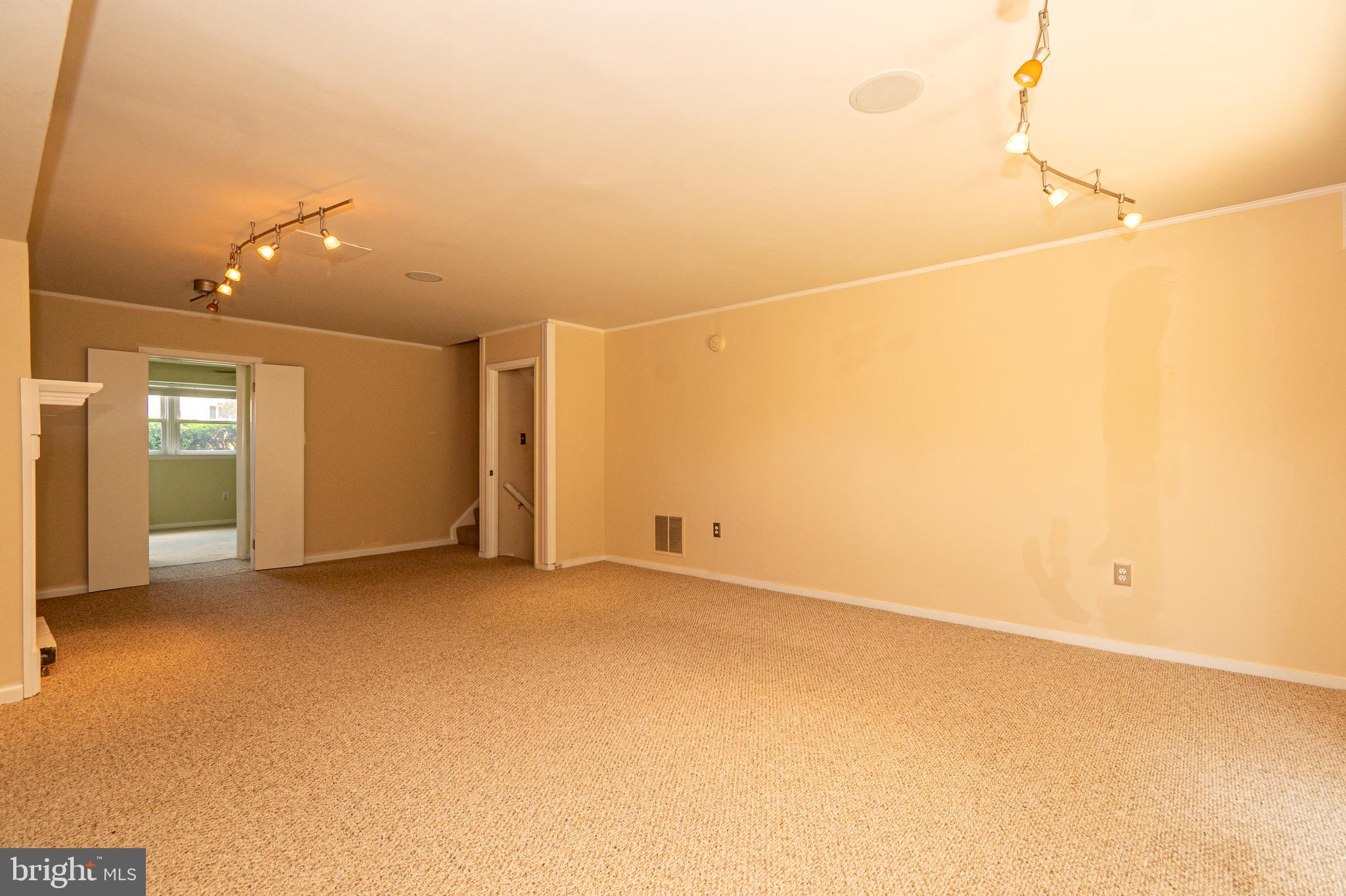4523 Hawksbury Road Baltimore, MD 21208 - Photo 26 of 35 an empty room with closet and windows