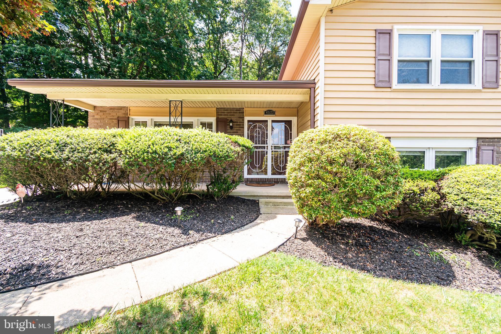 4523 Hawksbury Road Baltimore, MD 21208 - Photo 3 of 35 a front view of a house with garden
