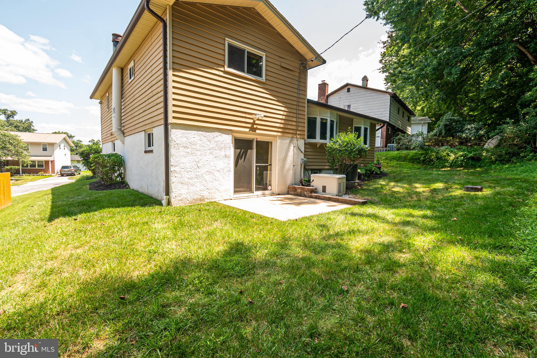 4523 Hawksbury Road Baltimore, MD 21208 - Photo 35 of 35 a view of a house with pool and a yard