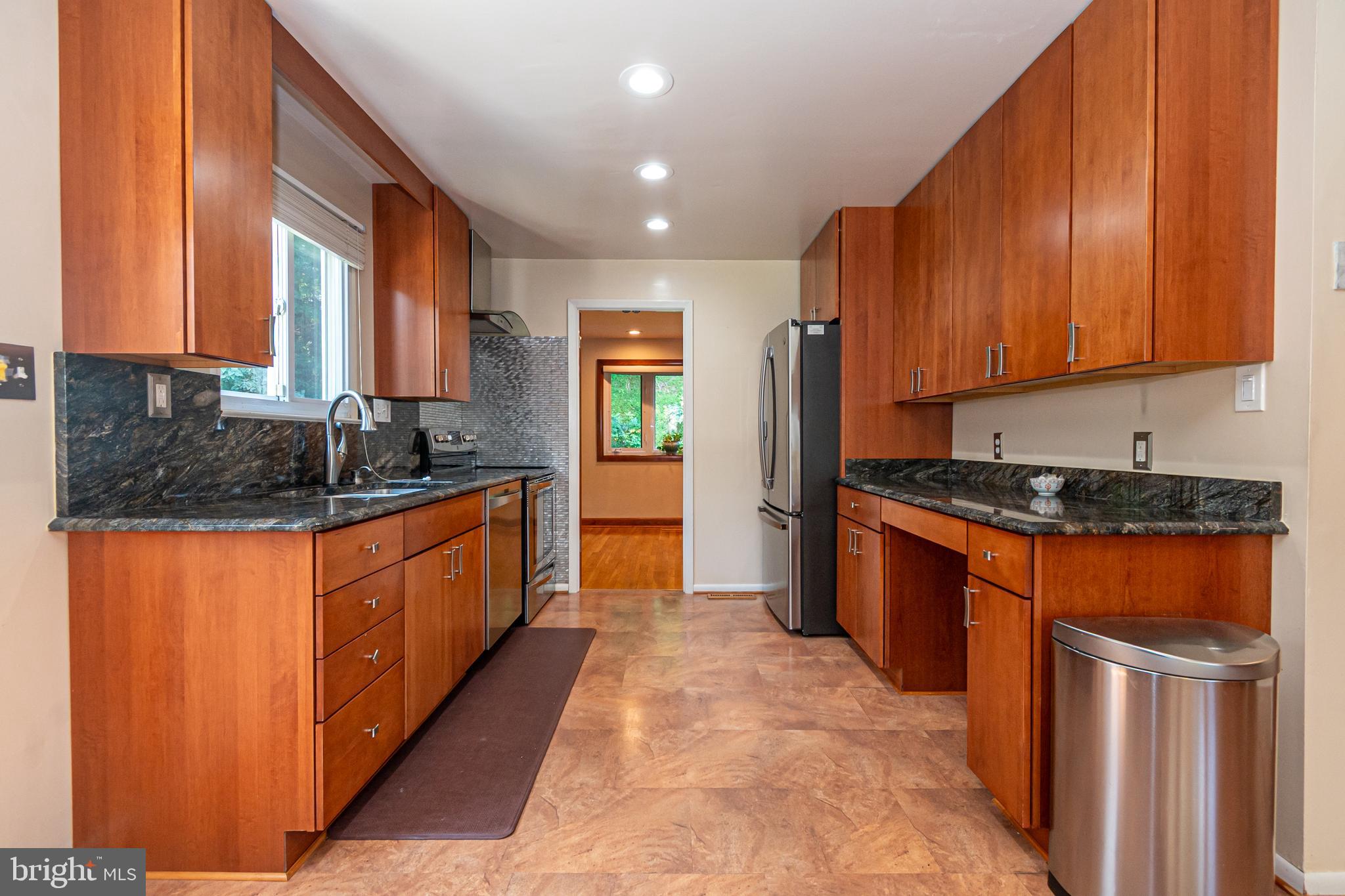 4523 Hawksbury Road Baltimore, MD 21208 - Photo 10 of 35 a large kitchen with stainless steel appliances granite countertop a stove a sink dishwasher and a refrigerator