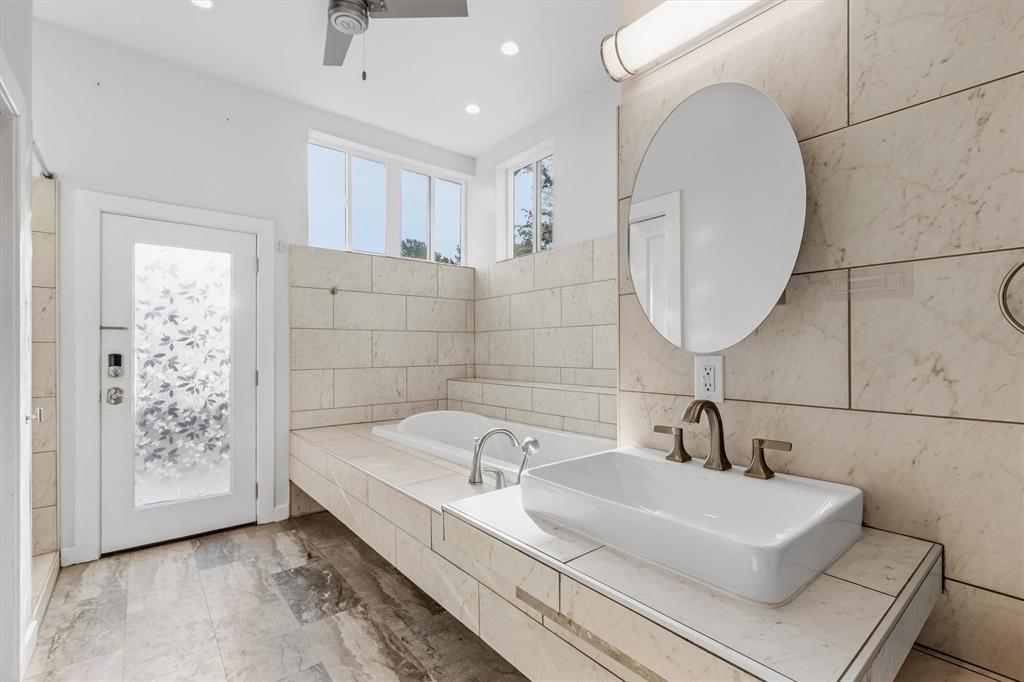 4436 Thunder Road Dallas, TX 75244 - Photo 22 of 33 Spacious bathroom featuring a vessel sink, an integrated soaking tub, recessed lighting, and a ceiling fan