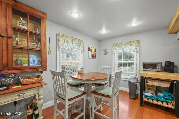a view of a dining room with furniture and a window