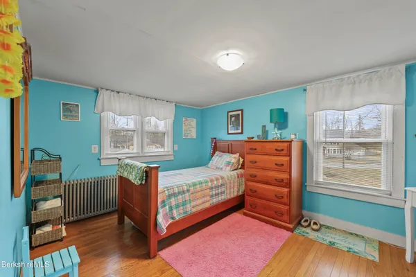 a bed room with a bed and a window