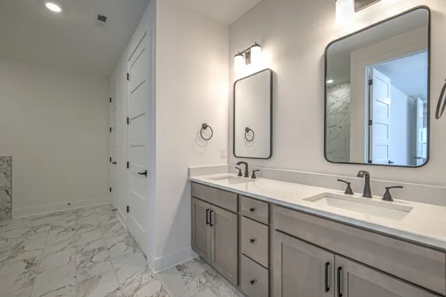 a bathroom with a bathtub and shower
