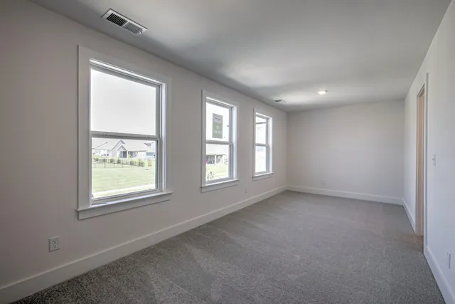 a bathroom with double vanity sinks and a mirror